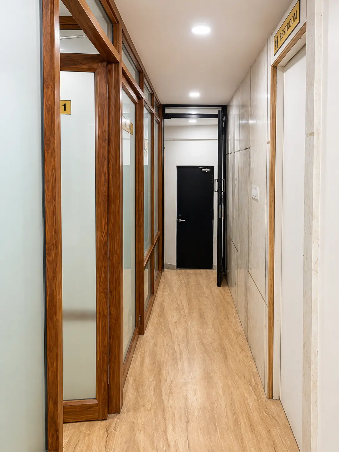 Clean clinic corridor and consultation rooms at Firstline Clinic